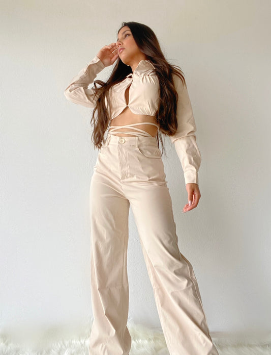 A fashion forward cropped blazer with criss cross tie detail and high waisted matching wide leg pants